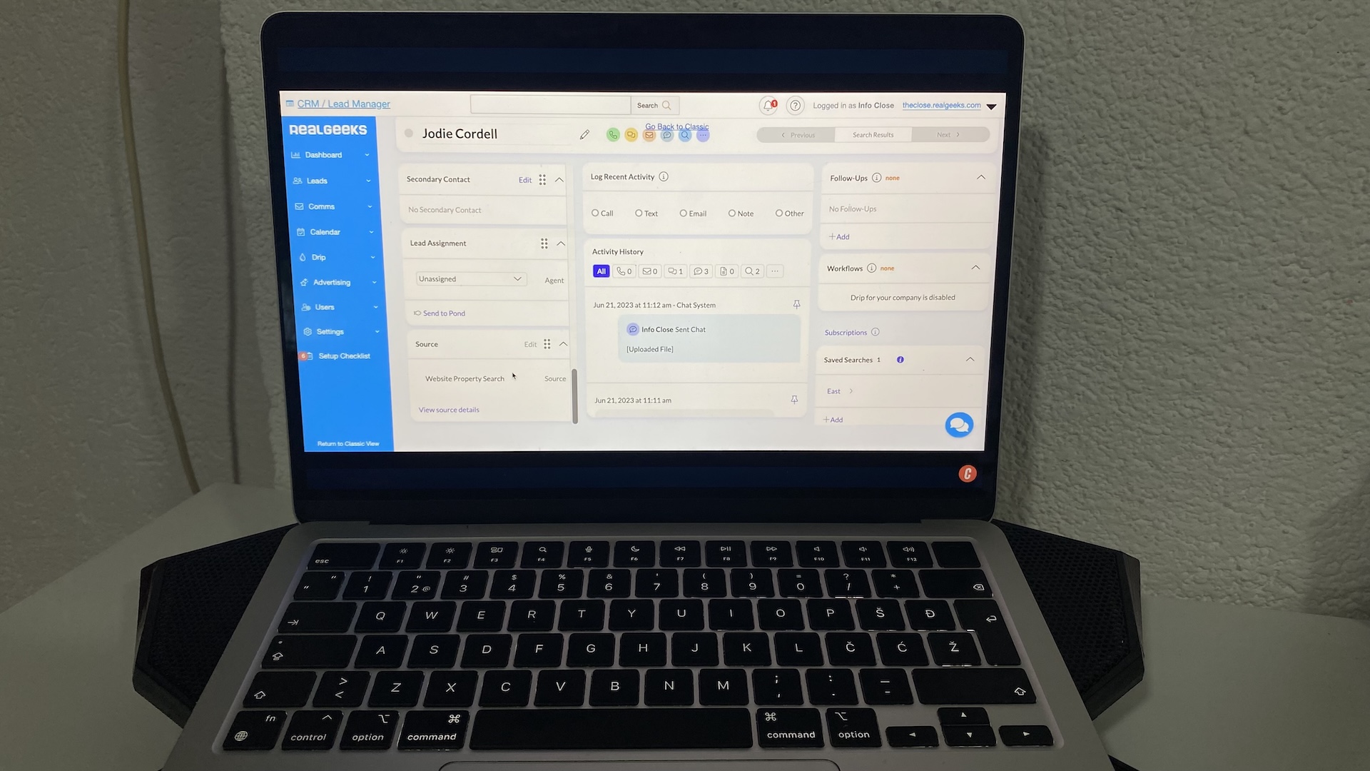 Real Geeks CRM contact record view showing lead details, recent activity, source, and follow-up options for agents.