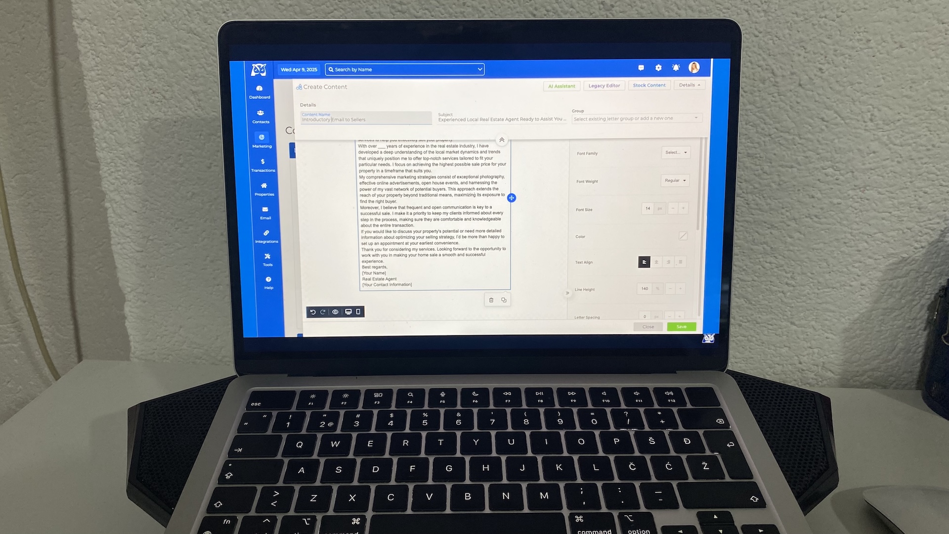 Laptop screen showing Wise Agent CRM interface with email editor for creating and customizing client communication.